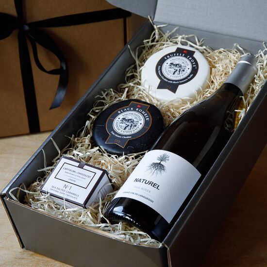 Cheese gift box with two cheddar truckles, artisan chocolates and wine in gift box