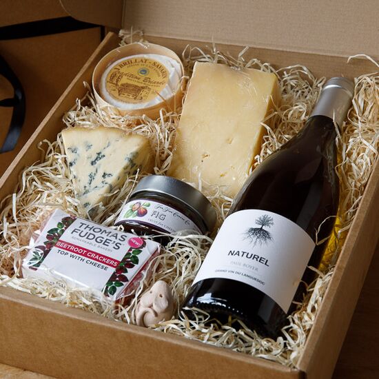 Wine and Cheese gift box includes bottle of wine, three cheeses, fig puree and crackers