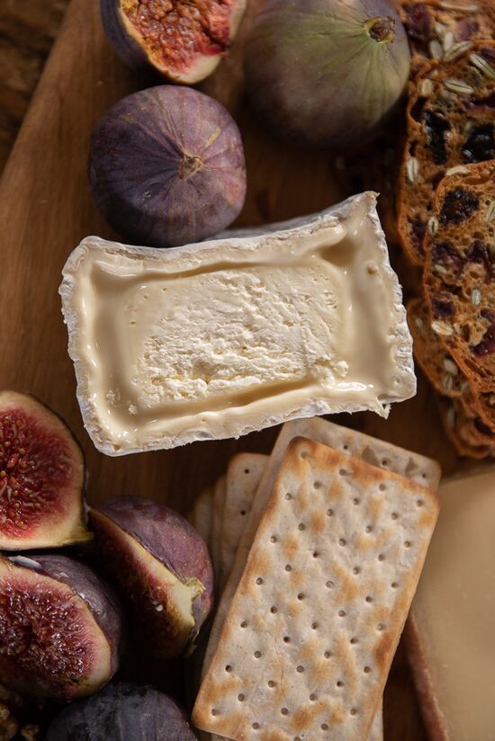 Chaource cheese, with crackers and figs and nuts