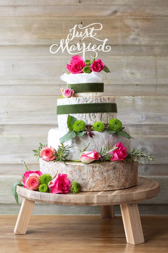 4 tier Angel cheese cake with beautiful green and pink flowers.