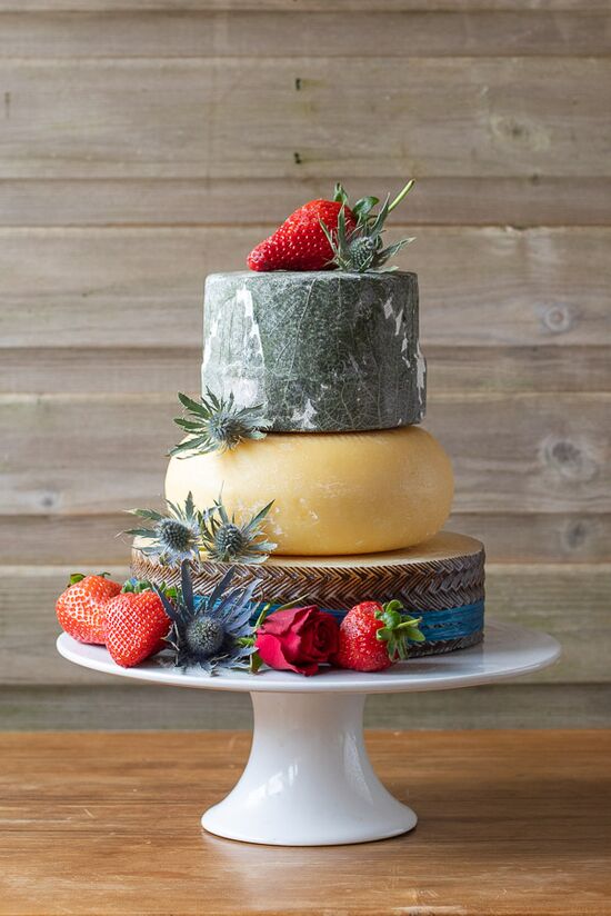Celebration Cheese Cake using two Sheets milk cheeses and decorated with raffia and strawberries