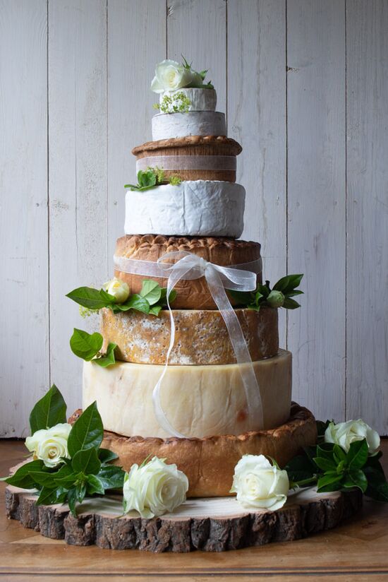 Pork Pie & Cheese Cake, with three pork pies and four cheeses decorated with organza ribbon