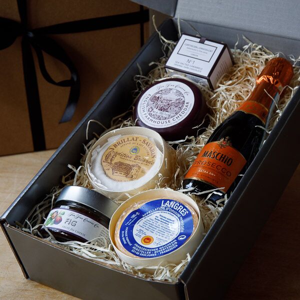 Cheese gift box with three cheeses, fig puree, dark chocolate salted caramels and mini Prosecco