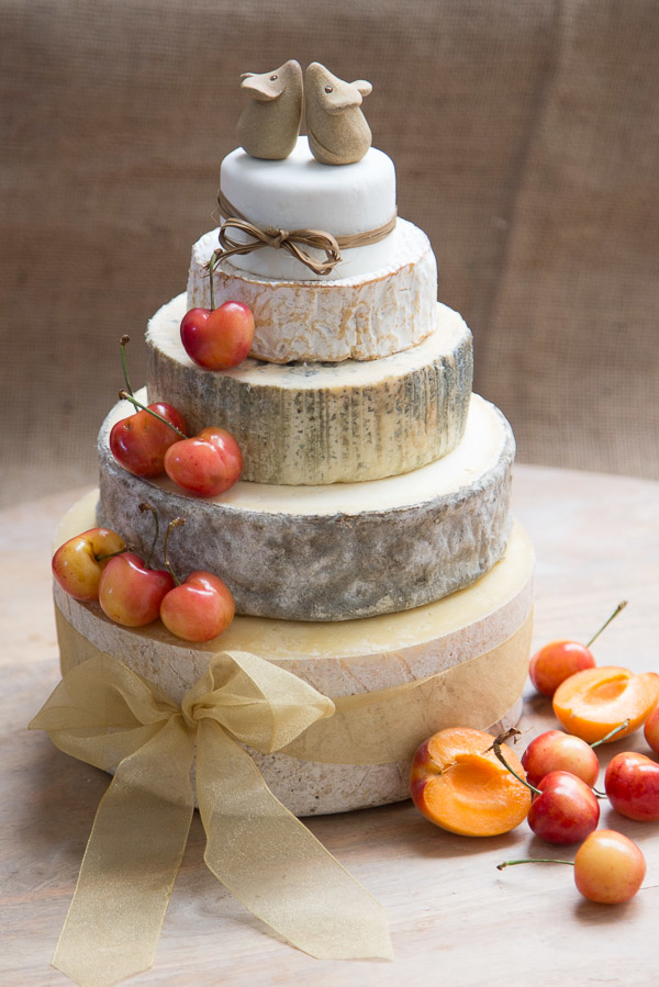 Our Cherry Cheese Cake has 5 tiers including, Devon Oke, Gorwydd Caerphilly, Cashel Blue, Camembert and Vulscombe. Decorated with Cherries and beige ribbons.